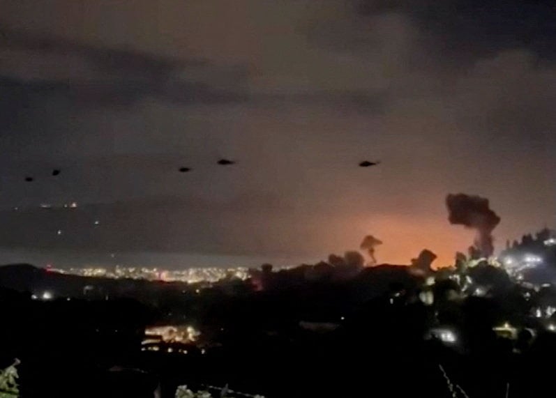 U.S. helicopters fly over Caracas, Venezuela during operation Absolute Resolve