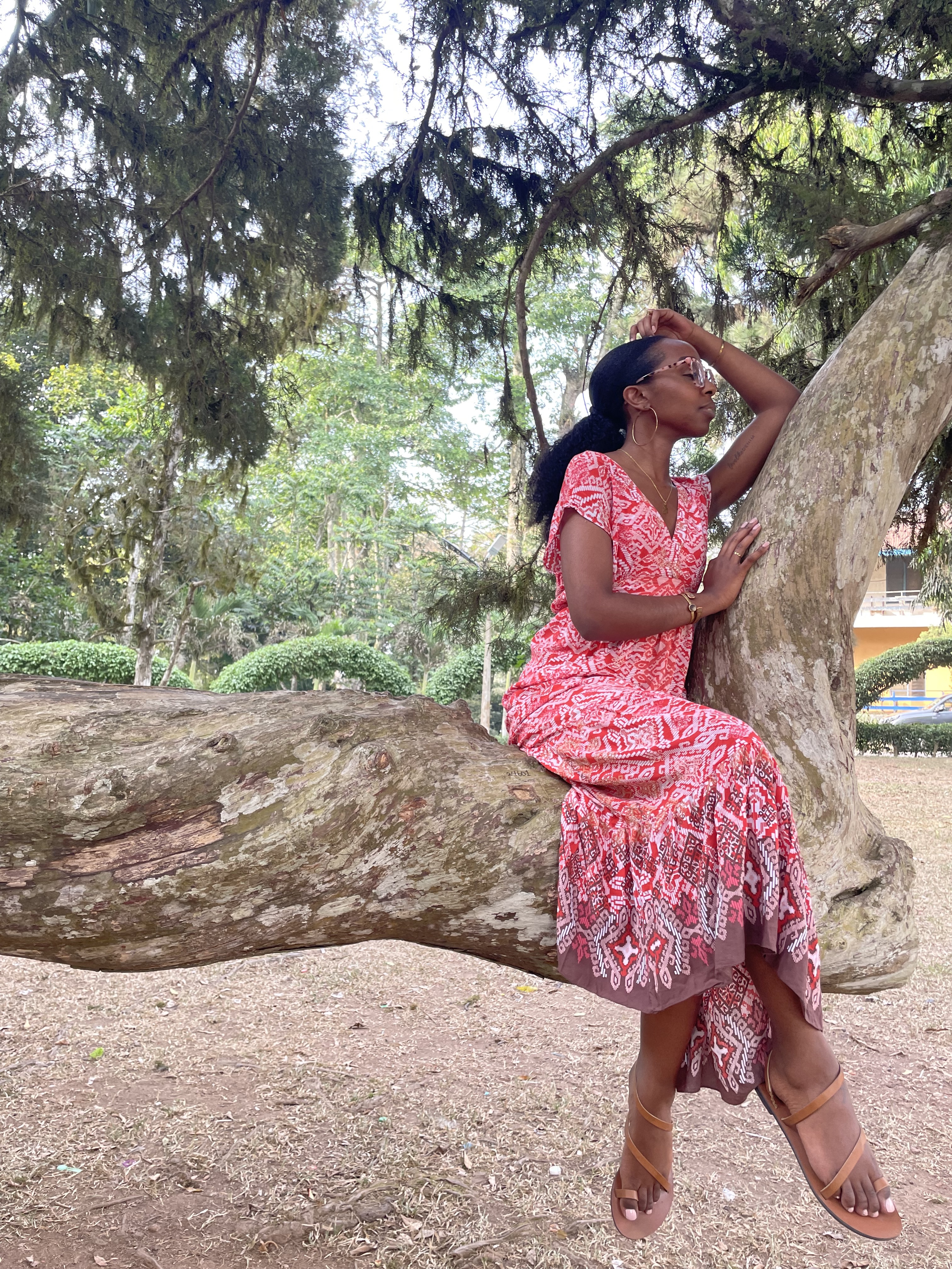Natalie Dean sits on a tree
